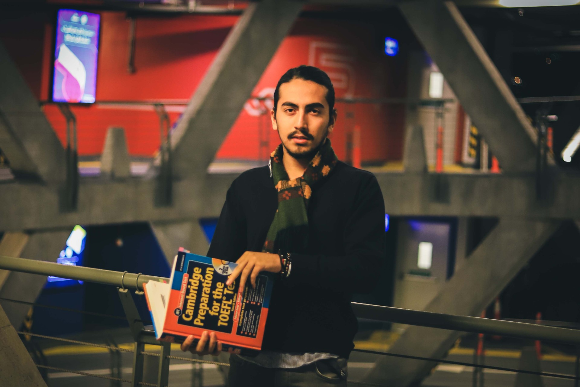 Student with Cambridge TOEFL book